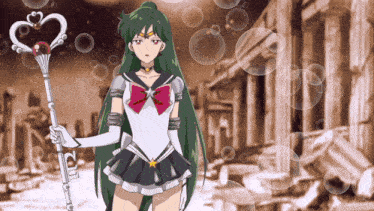 a girl with long green hair is holding a wand with a heart on it in front of a building
