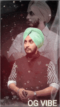 a man wearing a green turban is holding a cell phone and the words og vibe are above him