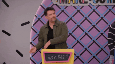 a man stands behind a podium that says josh on it