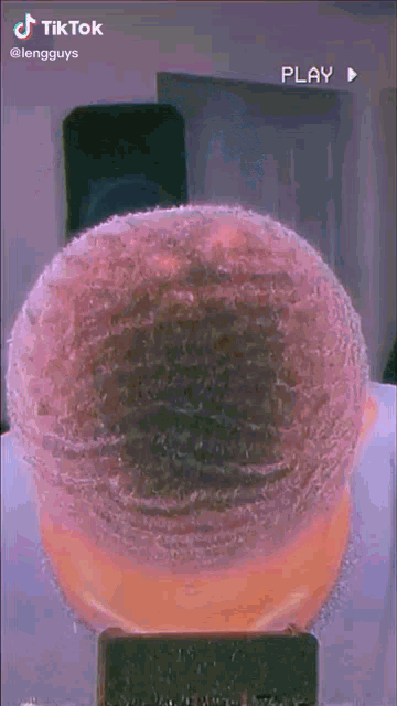 a close up of a person 's head with a purple background