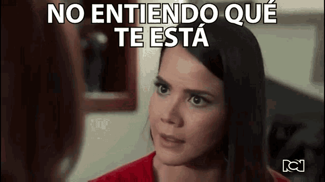 a woman in a red shirt is talking to another woman with the words no entiendo que te esta above her