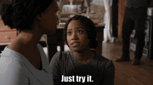 a woman says just try it while another woman looks on