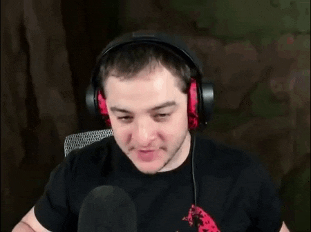 a man wearing headphones says sit down and shut the fuck up