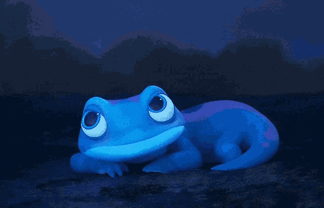 a blue and purple lizard with big eyes is laying on the ground