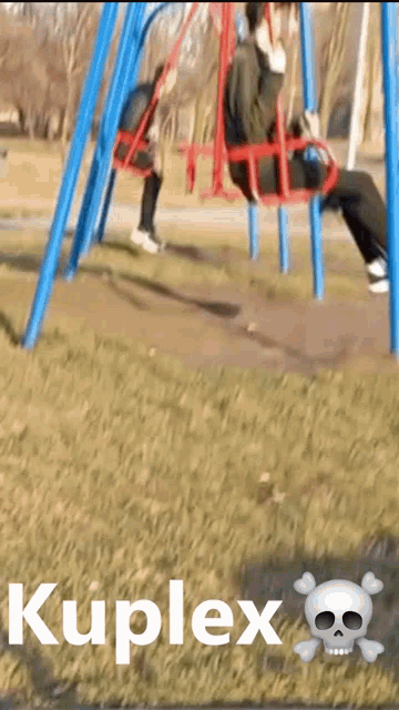 a person sitting on a swing with the word kuplex on the bottom of the image