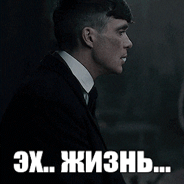 a man in a suit and tie is smoking a cigarette in a dark room with a caption in russian that says ex..