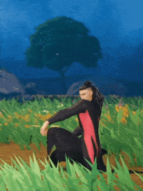 a man in a wet suit is kneeling down in a field