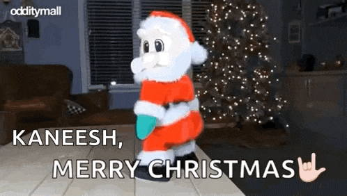 a santa claus figurine is dancing in front of a christmas tree .
