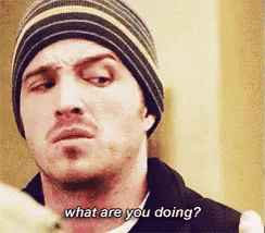 a man wearing a striped hat is asking what are you doing .