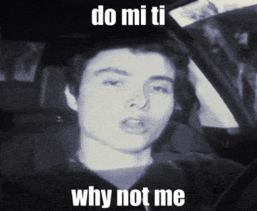 a black and white photo of a man with the words do mi ti why not me below him