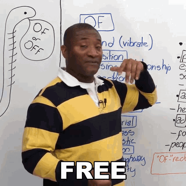 a man in a yellow and black striped shirt says " free " in front of a whiteboard
