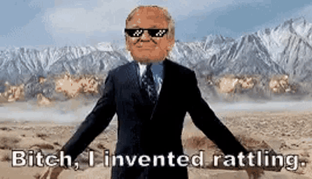 a man in a suit and tie is wearing sunglasses and saying bitch , i invented rattling .