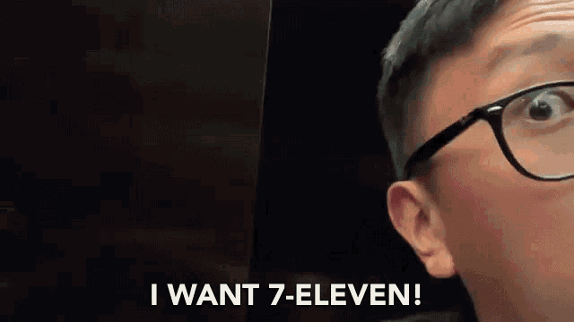 a person wearing glasses is saying i want 7 eleven