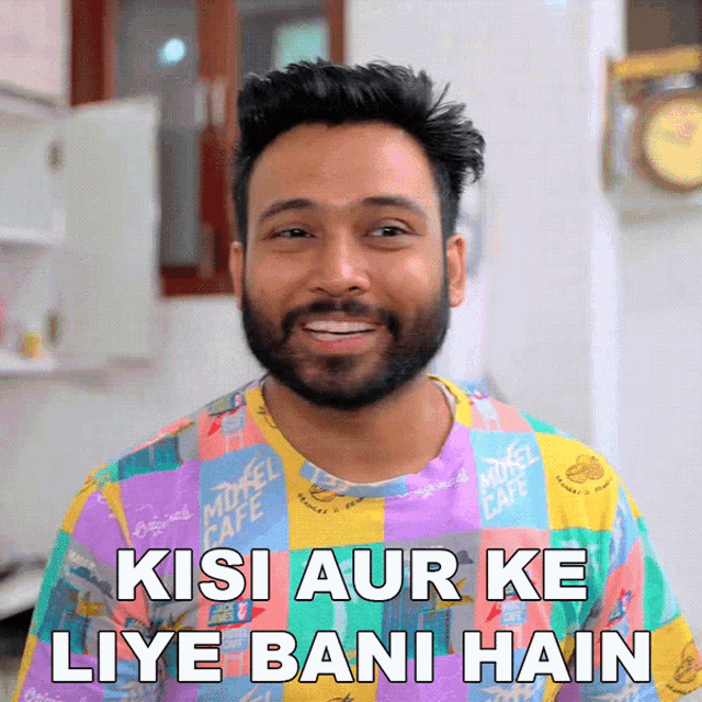 a man with a beard is wearing a shirt that says milk cafe