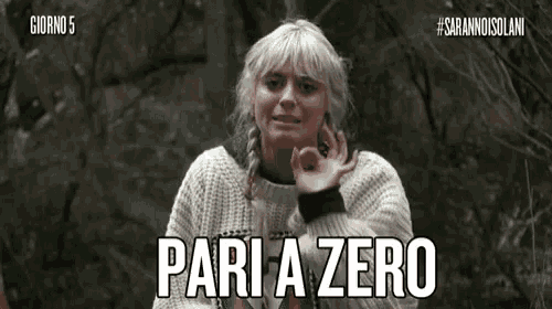 a woman in a white sweater is giving an okay sign and says pari a zero