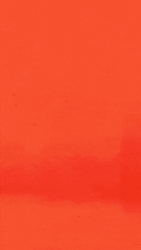 a black and white image of a mountain with a red background