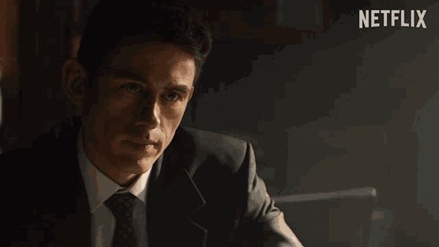 a man in a suit and tie is saying so