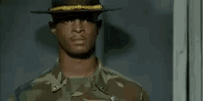 a man in a military uniform is smiling and saying `` really ? ''