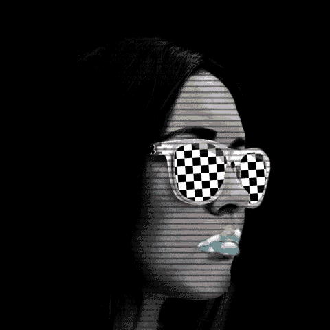 a woman wearing sunglasses with a checkered pattern on them