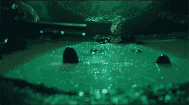 a person is laying in a bathtub with bubbles coming out of the water