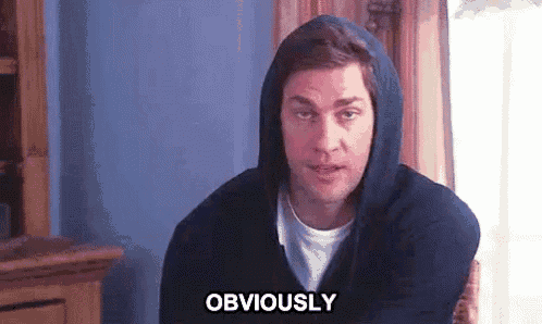 a man in a hooded sweatshirt is sitting in a chair and says obviously .