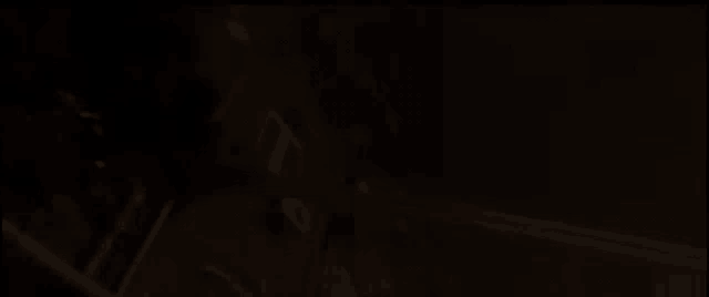 a dark background with a few lines of light coming through it