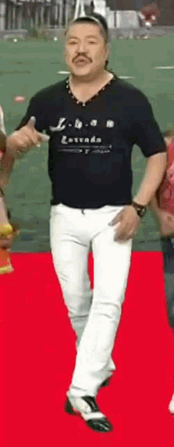 a man with a mustache is wearing a black t-shirt that says nevada