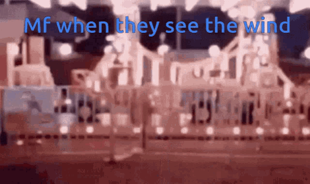 a blurry picture with the words mf when they see the wind in blue