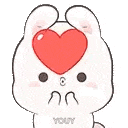a white bunny with a red heart on its head .
