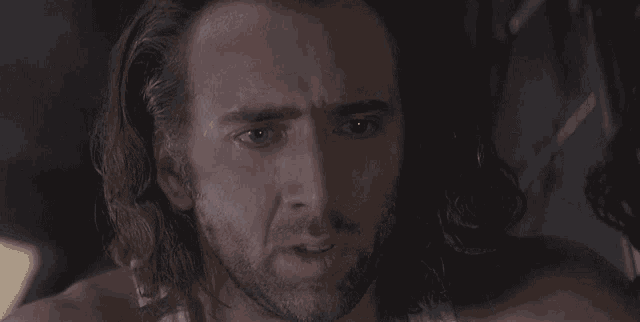 a man with long hair and a beard is saying i 'll show you god does exist