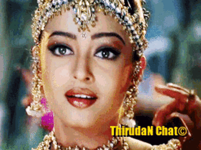 a close up of a woman 's face with the words thiruda n chat on the bottom right