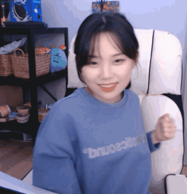 a girl wearing a blue sweatshirt that says brupeoteam