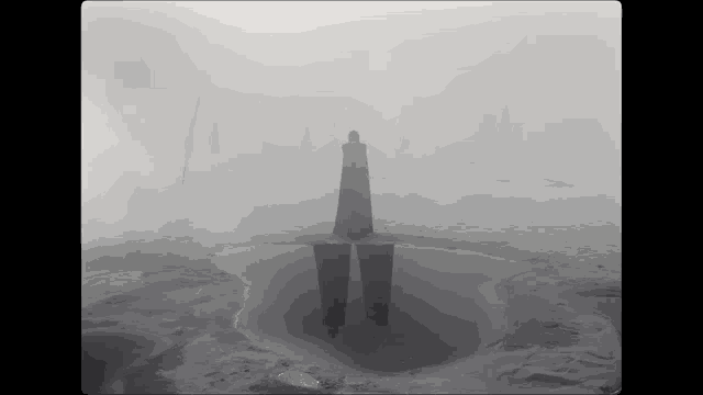 a black and white photo of a person standing in the fog