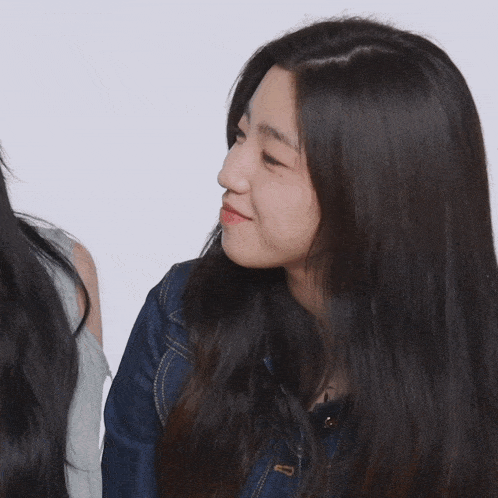 a close up of a woman 's face with long hair