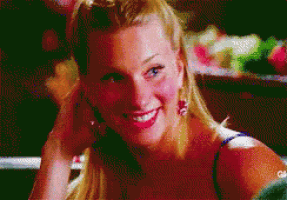 a close up of a woman 's face with a blurry background that says cbs on it