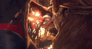 a woman is laying in front of a field of fire .