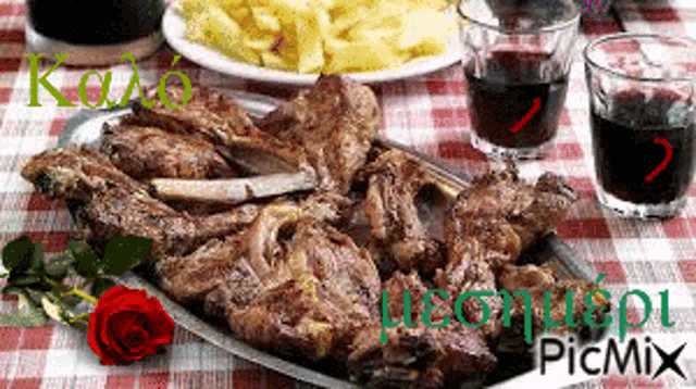 a plate of meat and french fries on a checkered table cloth with picmix in the corner