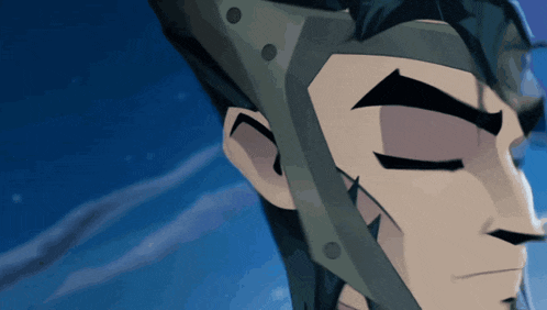a close up of a man 's face with a helmet on