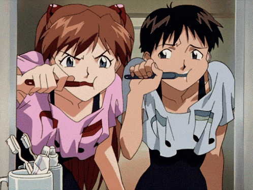 a boy and a girl brushing their teeth together in a bathroom