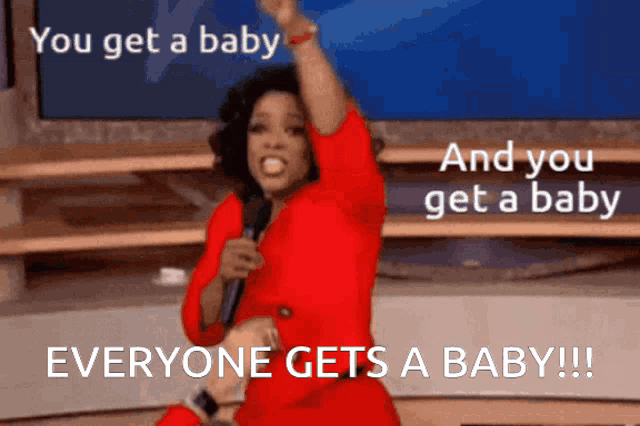 a woman in a red dress is holding a microphone and says " you get a baby and you get a baby "