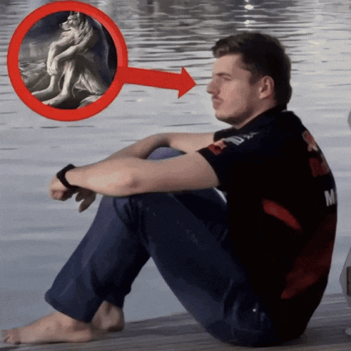 a man sits on a dock with a red arrow pointing to a painting of a wolf