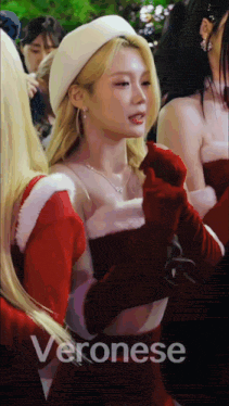 a woman in a red dress with the word veronese on the bottom right