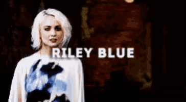 a woman with blonde hair and the name riley blue on the bottom