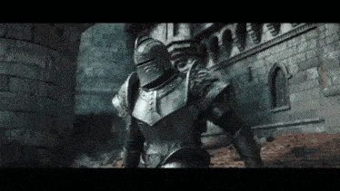 a knight in armor is standing in front of a stone building .