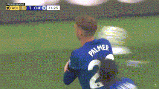 a soccer player wearing a blue jersey with the number 20 on the back