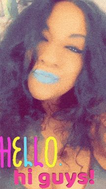 a woman with blue lipstick says hello hi guys on her face