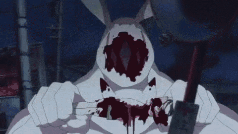 a cartoon rabbit with blood on its face is holding a sword .