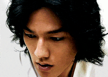 a close up of a person 's face with a white shirt on