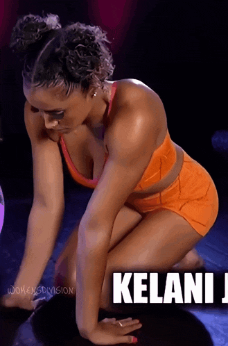 a woman is kneeling down in front of a sign that says kelani