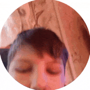 a close up of a person 's face in a red circle